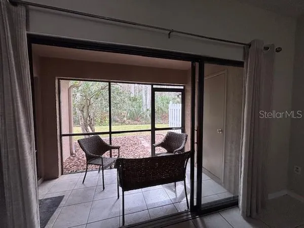 a dining room with furniture and a window