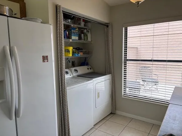 a utility room with dryer and washer
