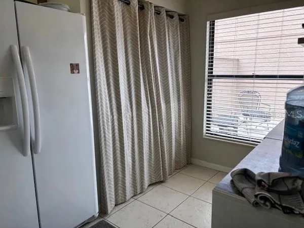 a view of a storage & utility room with a window
