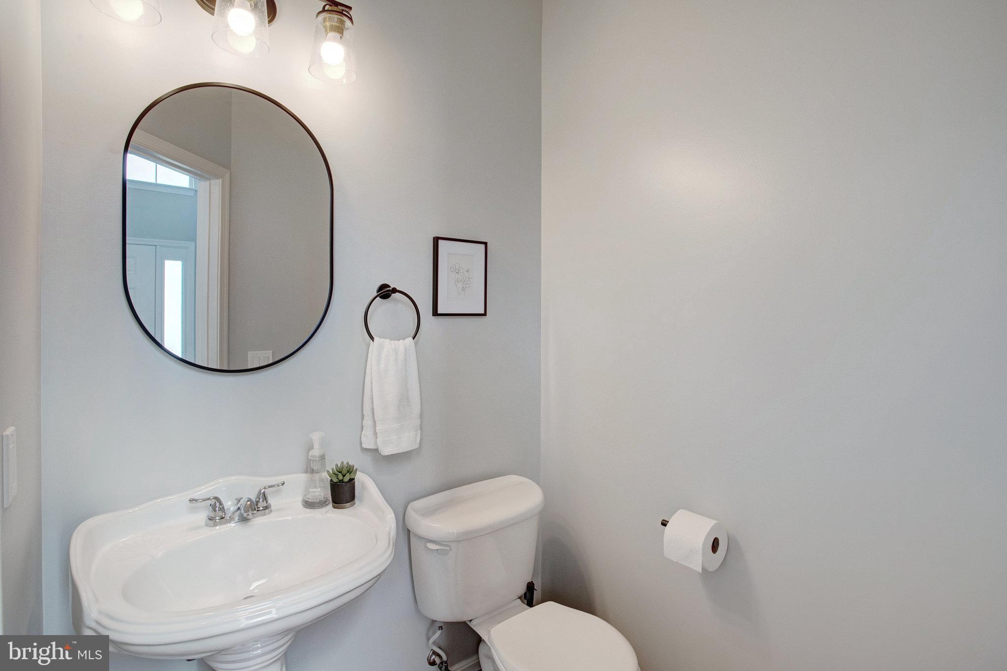 10375 Navarone Place Manassas, VA 20110 - Photo 17 of 51 a bathroom with a toilet sink and mirror