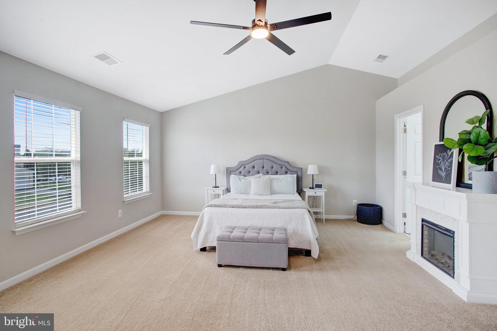 10375 Navarone Place Manassas, VA 20110 - Photo 19 of 51 a bedroom with a bed fireplace and window