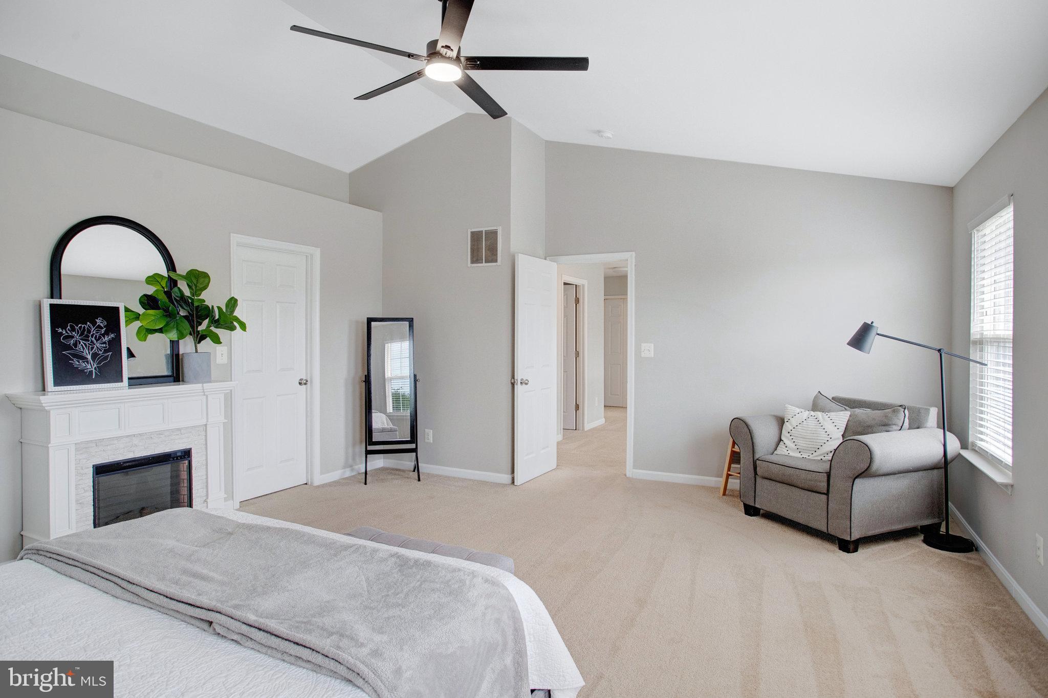 10375 Navarone Place Manassas, VA 20110 - Photo 21 of 51 a bedroom with a bed and a fireplace