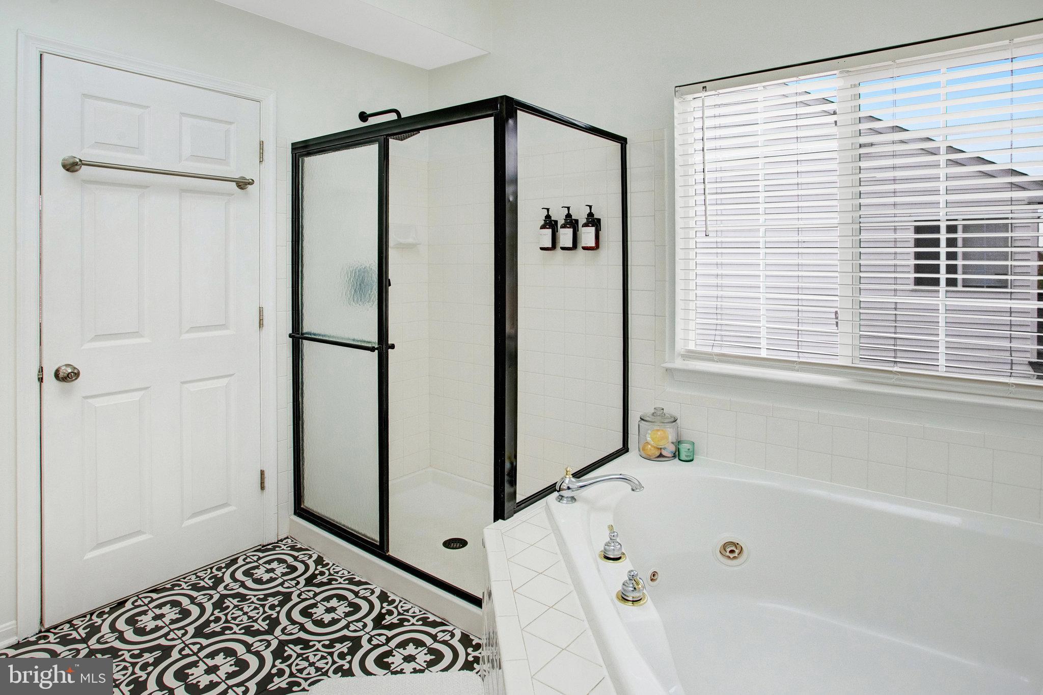 10375 Navarone Place Manassas, VA 20110 - Photo 23 of 51 a bathroom with a bathtub and a shower