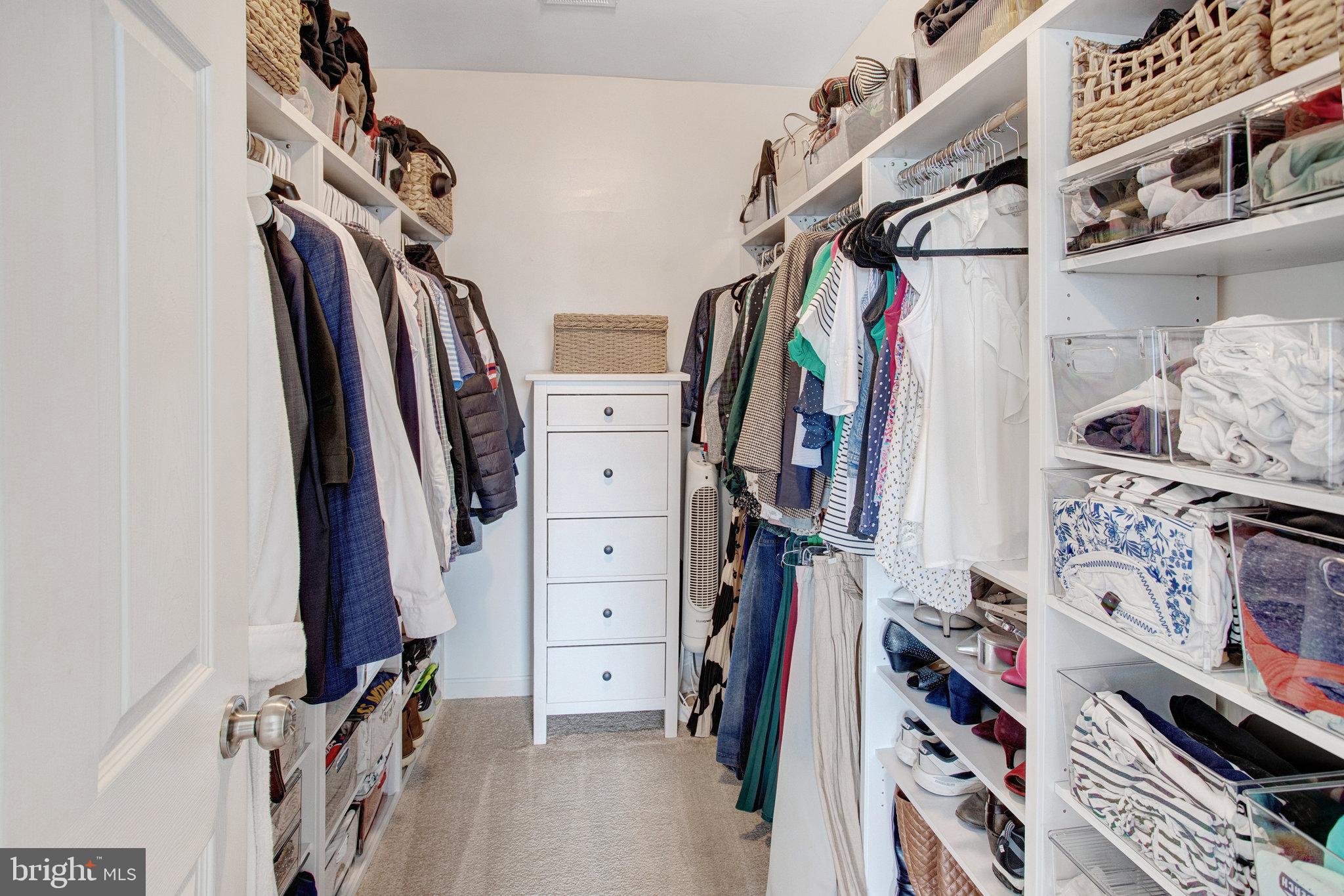 10375 Navarone Place Manassas, VA 20110 - Photo 24 of 51 a view of walk in closet with clothes and shoes