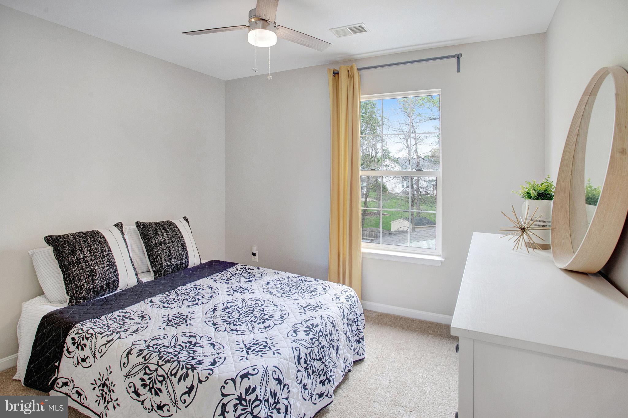10375 Navarone Place Manassas, VA 20110 - Photo 26 of 51 a bedroom with a large bed and a window