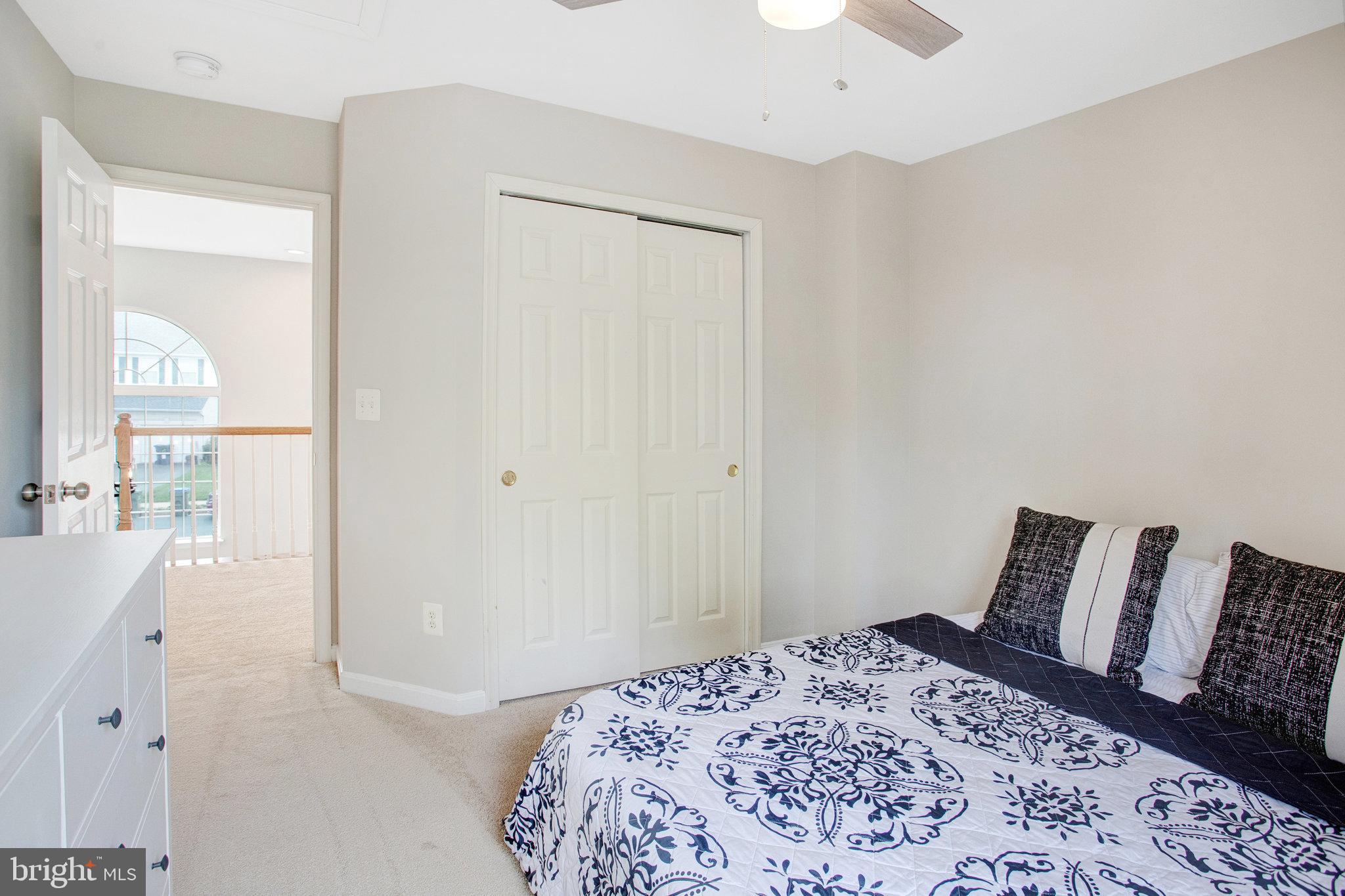 10375 Navarone Place Manassas, VA 20110 - Photo 27 of 51 a bedroom with a bed and a window