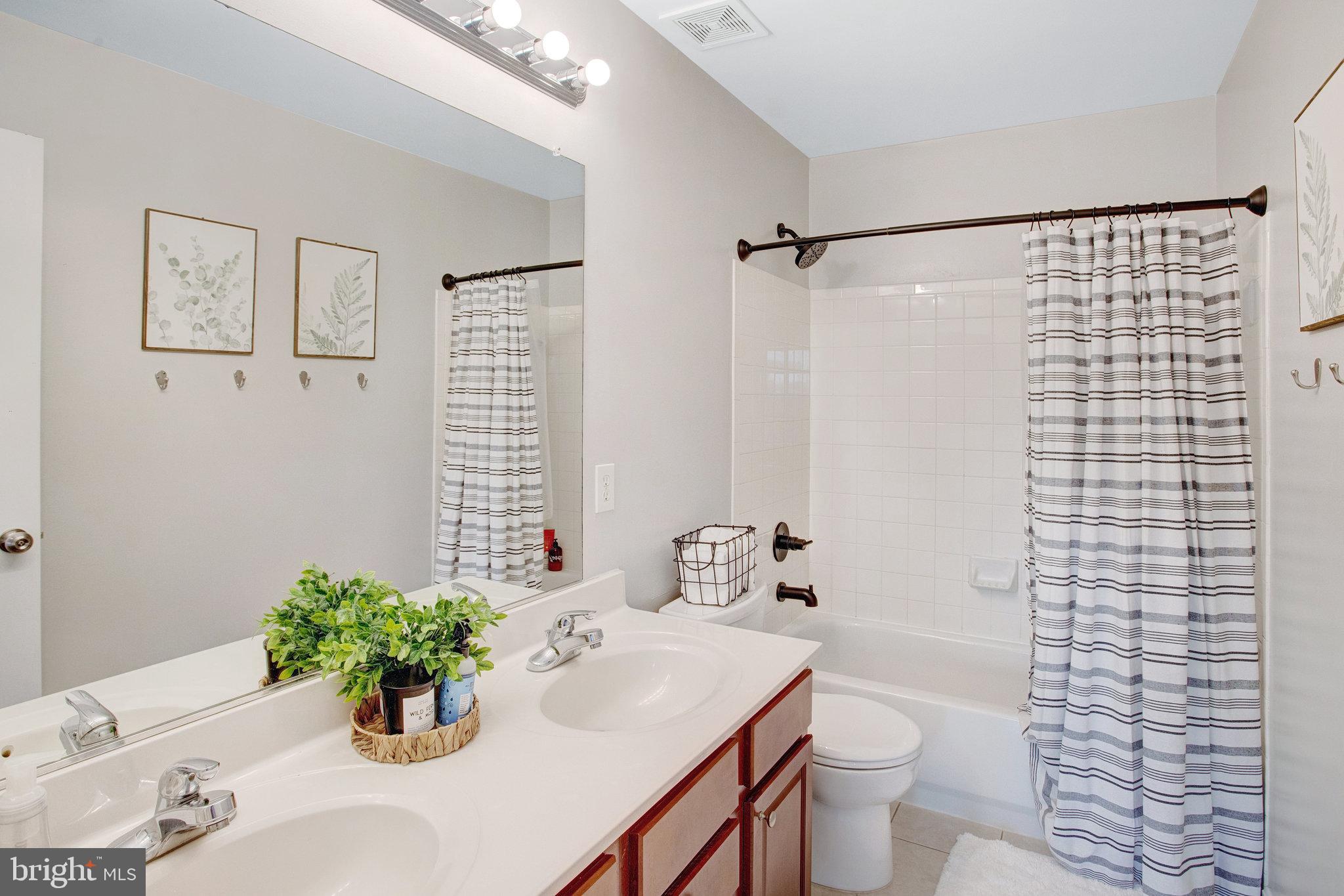 10375 Navarone Place Manassas, VA 20110 - Photo 28 of 51 a bathroom with a sink toilet and shower