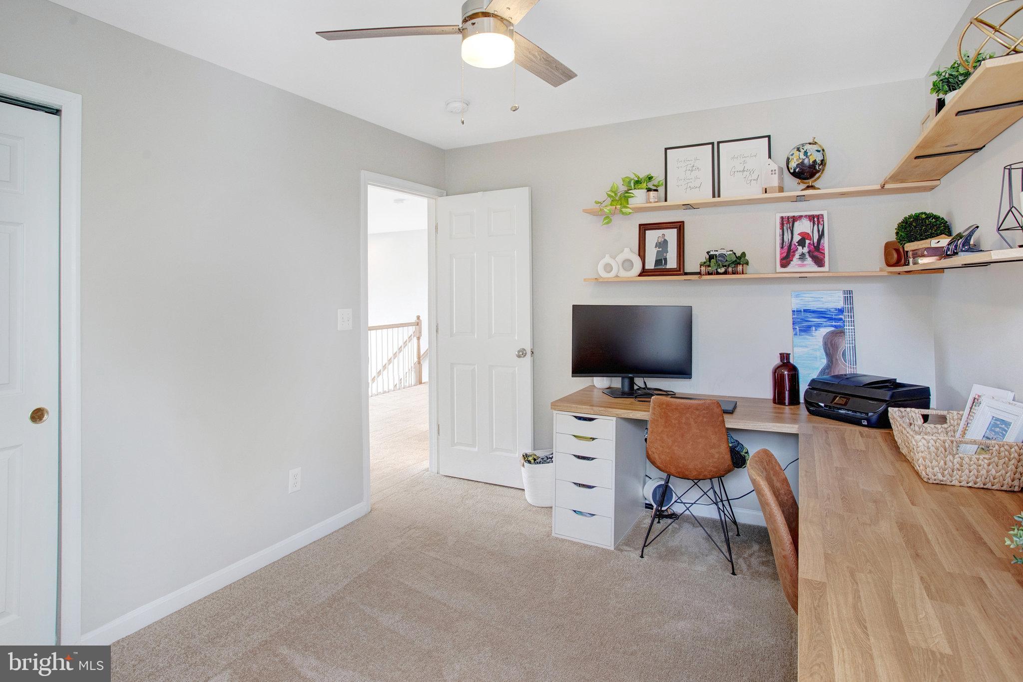 10375 Navarone Place Manassas, VA 20110 - Photo 30 of 51 a living room with furniture and a flat screen tv