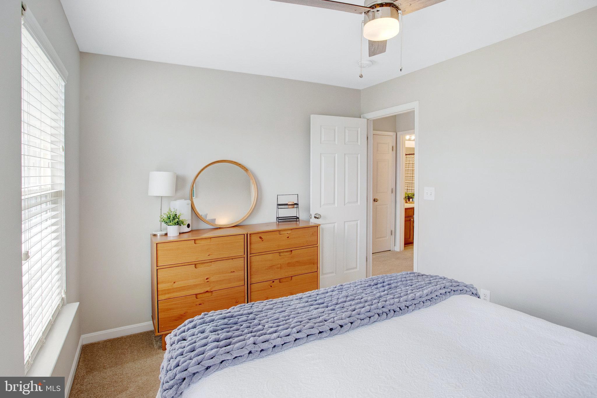 10375 Navarone Place Manassas, VA 20110 - Photo 32 of 51 a bedroom with a bed and a dresser