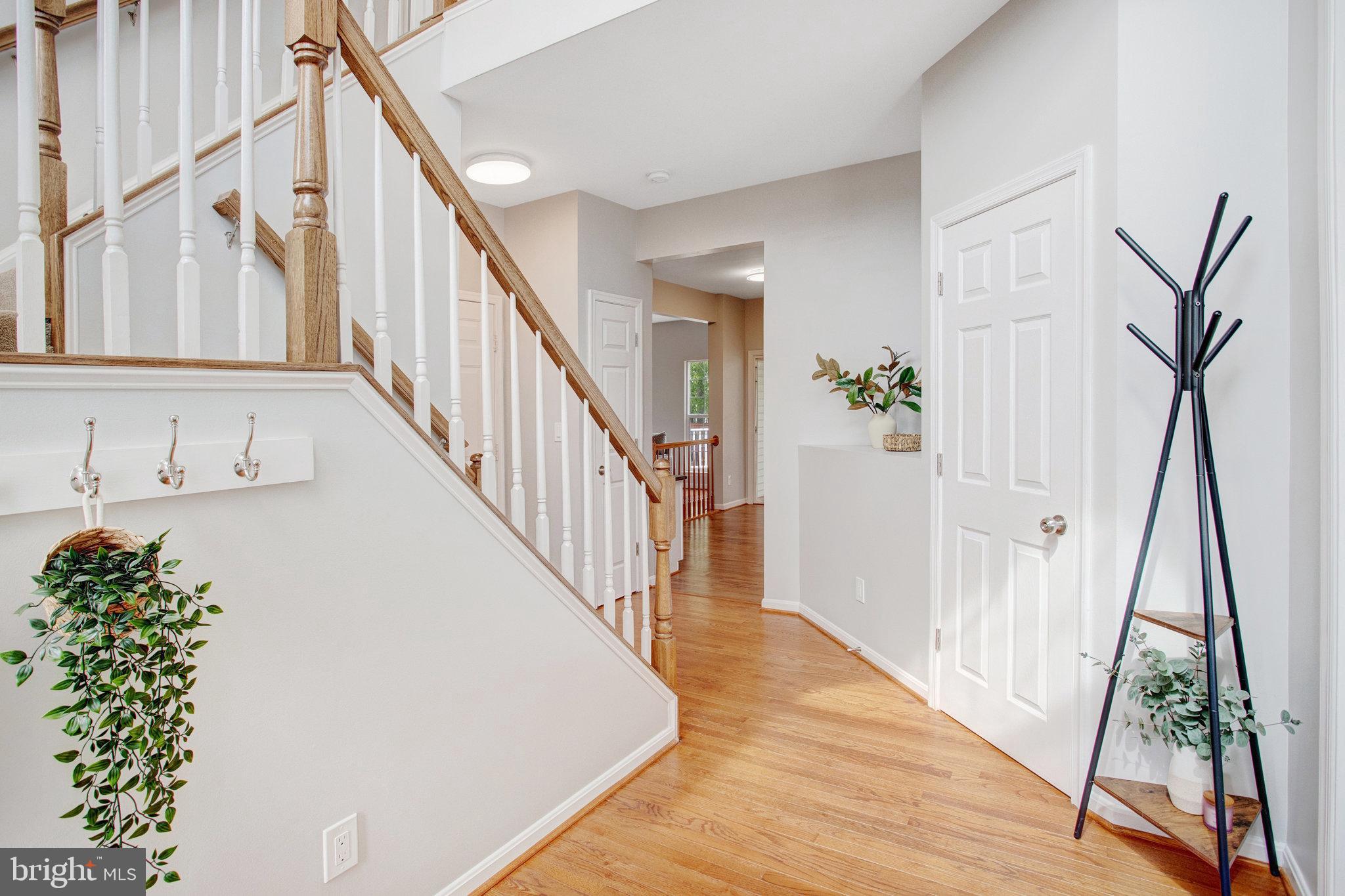 10375 Navarone Place Manassas, VA 20110 - Photo 4 of 51 a view of entryway with wooden floor