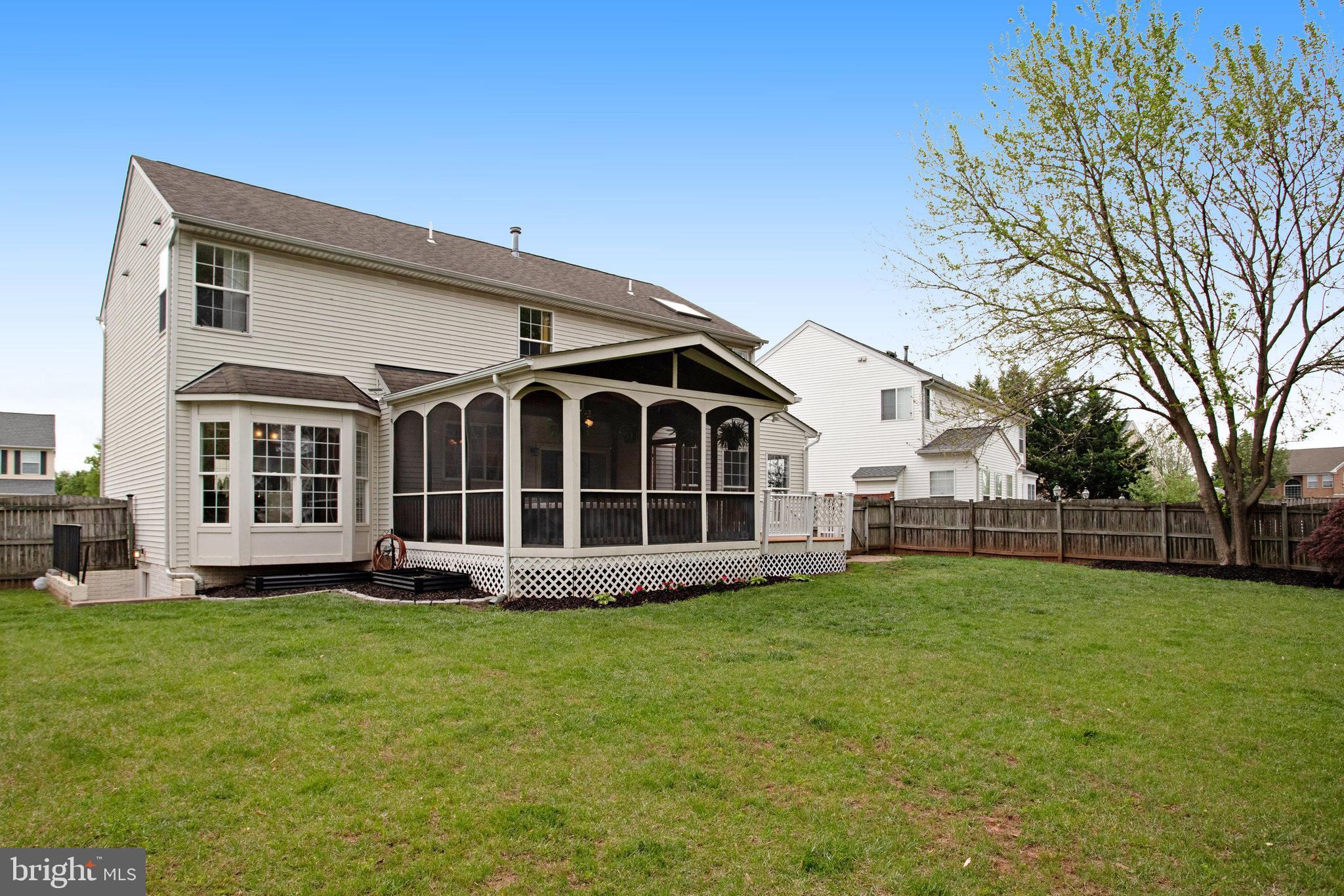 10375 Navarone Place Manassas, VA 20110 - Photo 46 of 51 a view of a house with a yard and sitting area