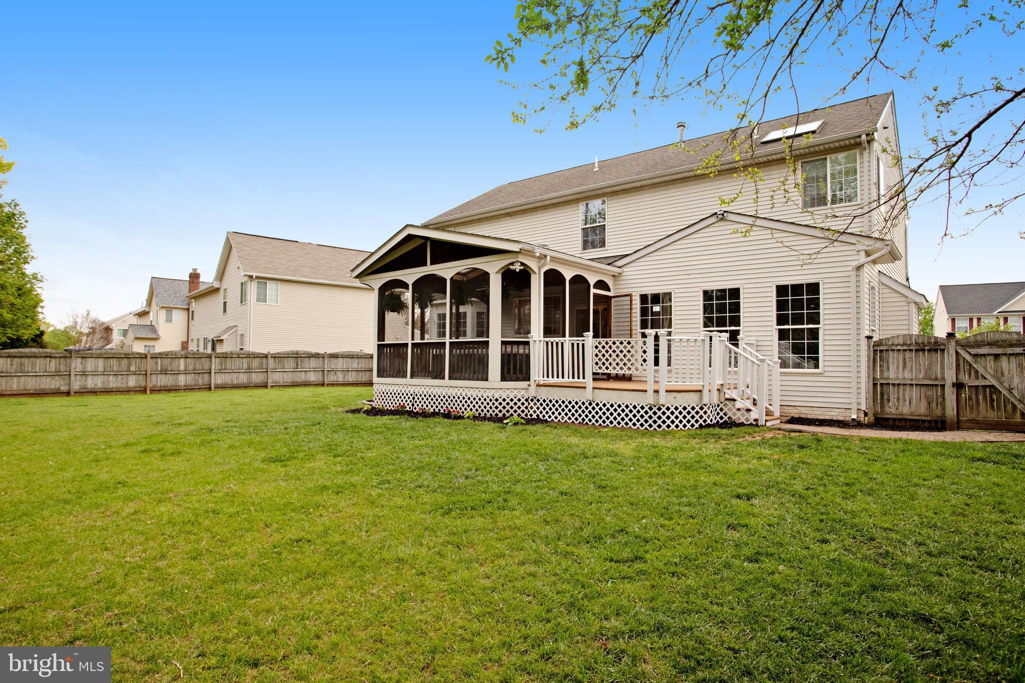 10375 Navarone Place Manassas, VA 20110 - Photo 47 of 51 a view of a house with a yard