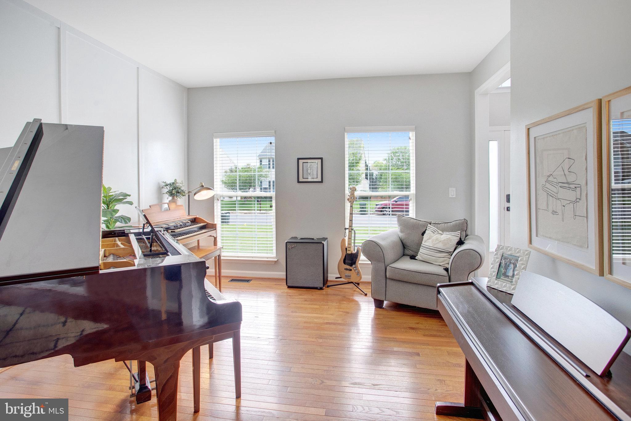 10375 Navarone Place Manassas, VA 20110 - Photo 6 of 51 a living room with furniture and wooden floor