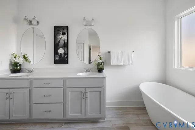 a bathroom with a granite countertop sink a toilet and a bathtub