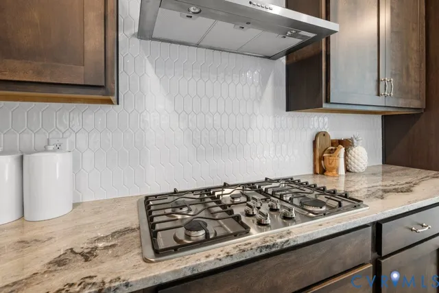a kitchen with a stove and a sink