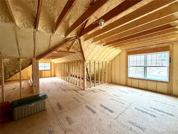 a view of an empty room with a fireplace
