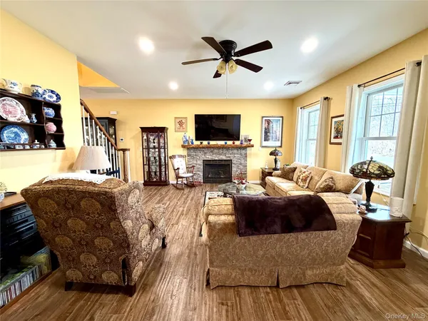 a living room with furniture fireplace and a flat screen tv