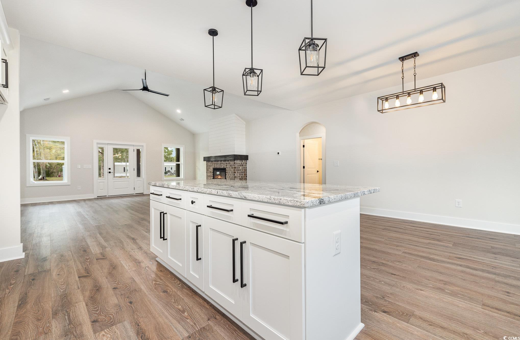 983 Pisgah Church Road Aynor, SC 29511 - Photo 37 of 37 Kitchen featuring open floor plan, a brick firepla