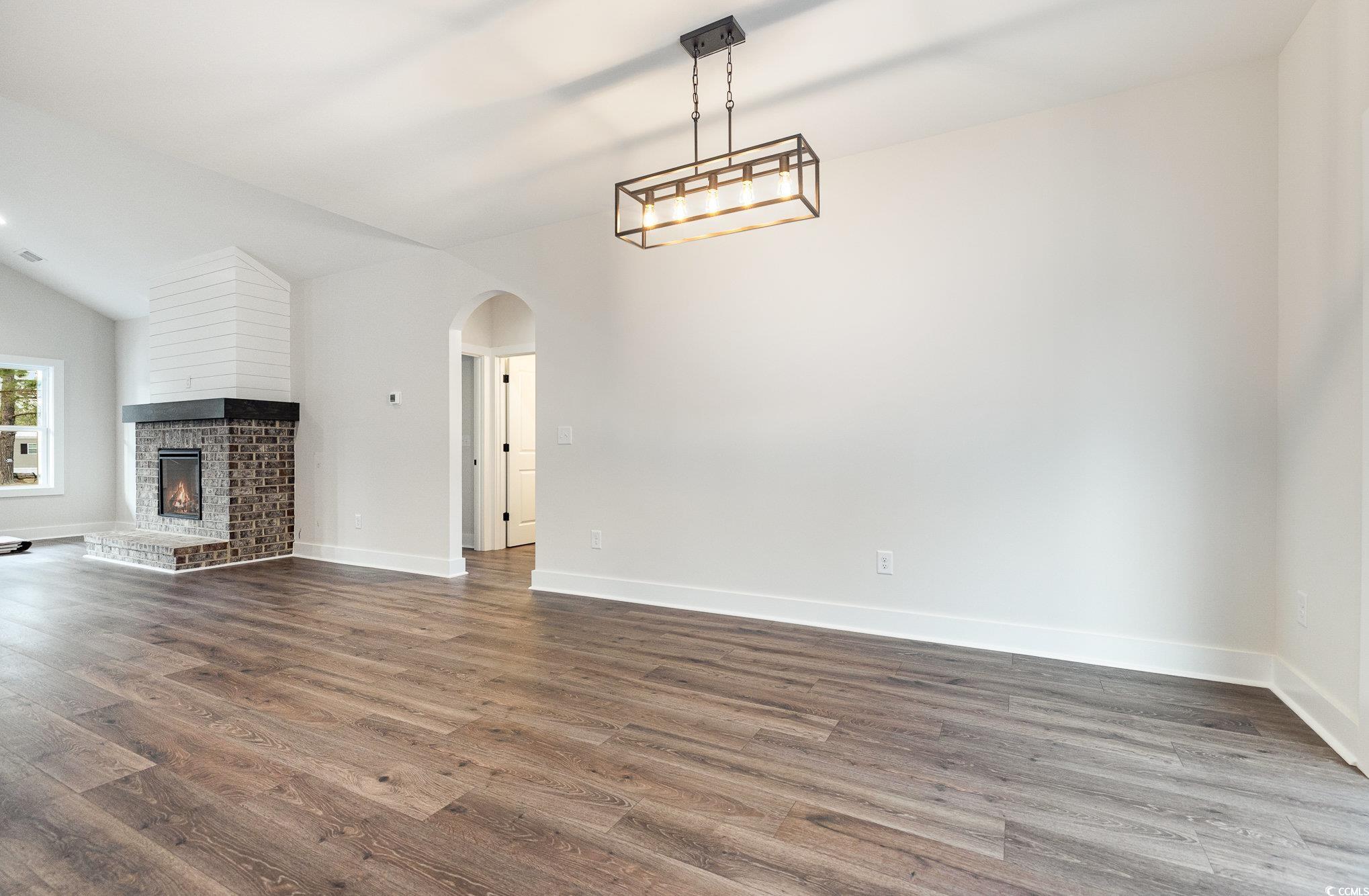983 Pisgah Church Road Aynor, SC 29511 - Photo 18 of 37 Unfurnished living room featuring lofted ceiling,