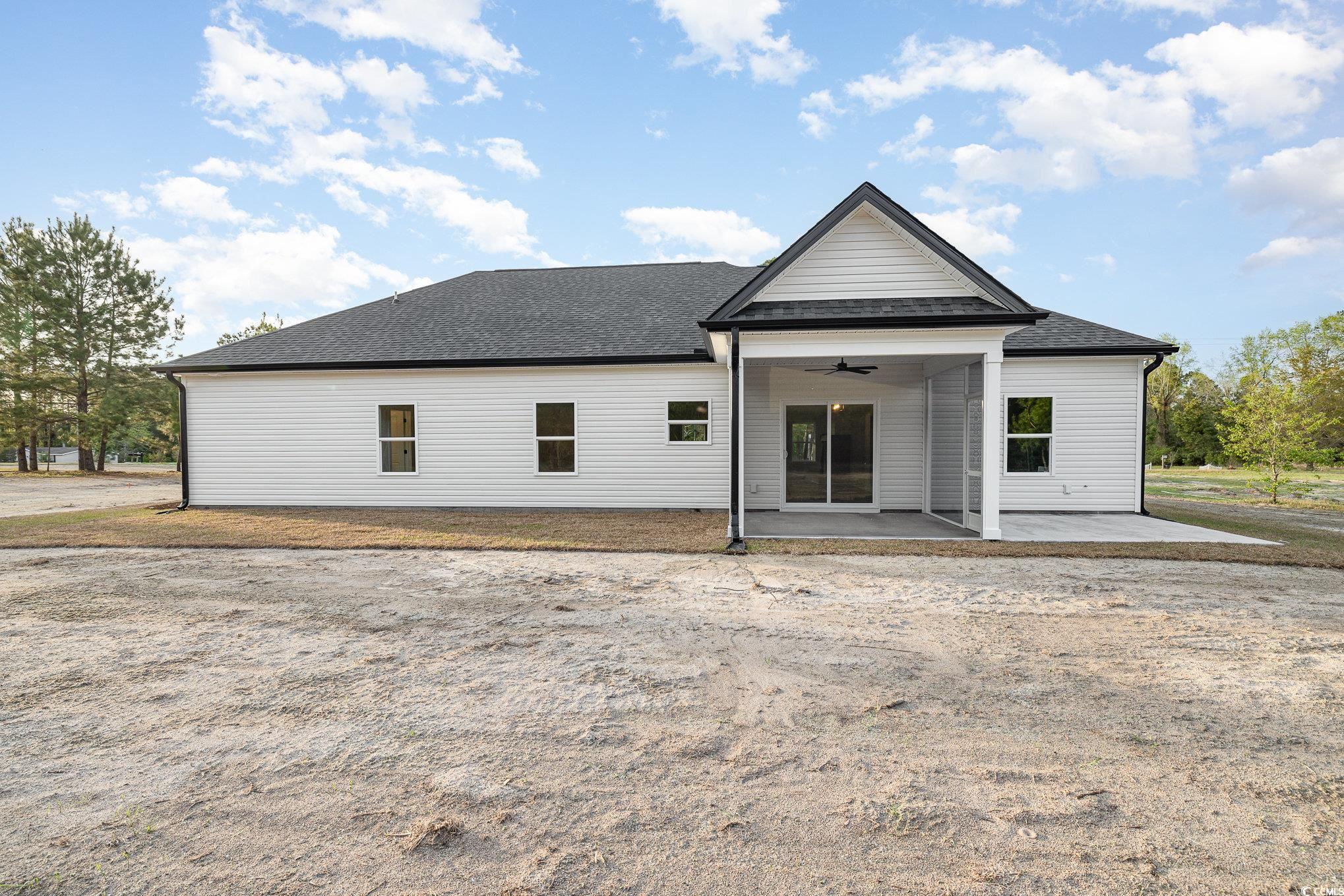 983 Pisgah Church Road Aynor, SC 29511 - Photo 31 of 37 Rear view of house with a patio, a shingled roof,