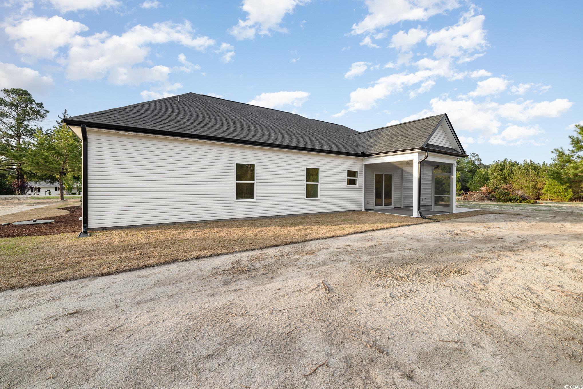 983 Pisgah Church Road Aynor, SC 29511 - Photo 32 of 37 Back of house with a sunroom and roof with shingle