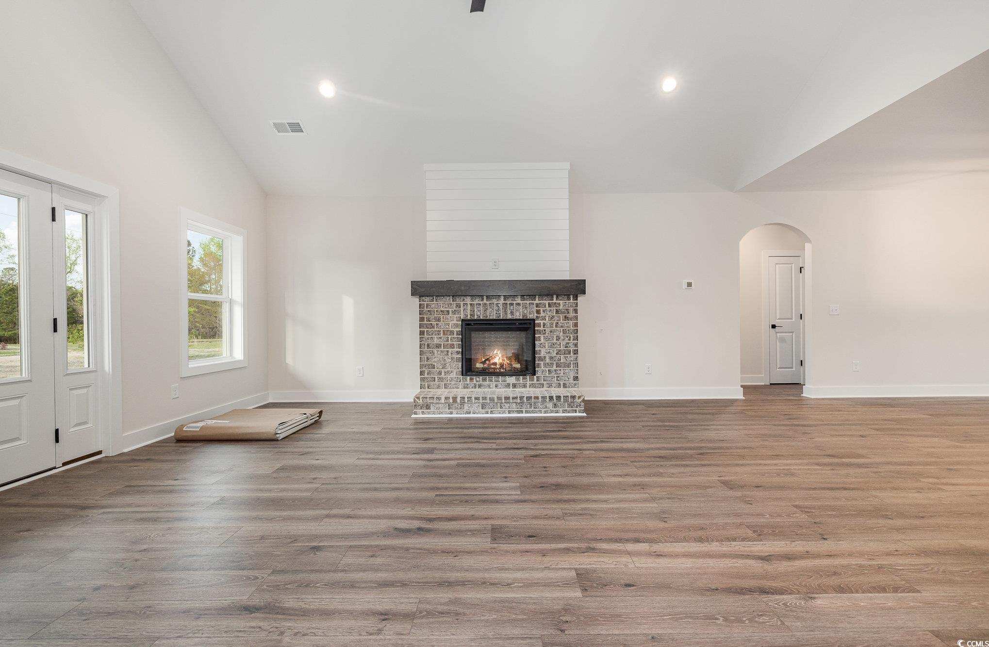 Unfurnished living room with light wood-type floor