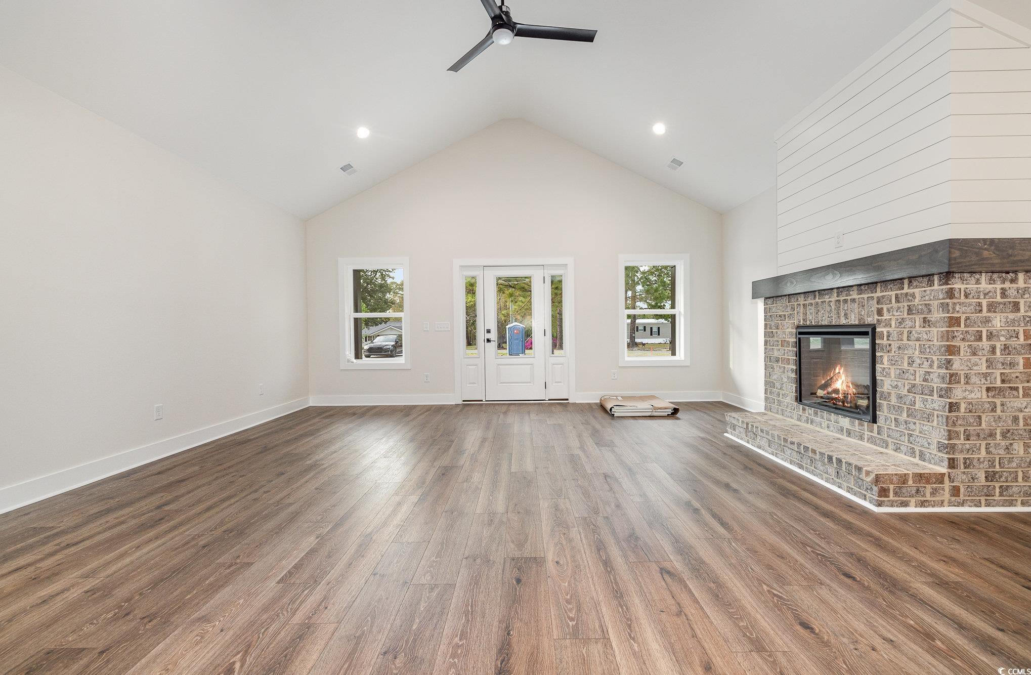 983 Pisgah Church Road Aynor, SC 29511 - Photo 8 of 37 Unfurnished living room featuring wood finished fl