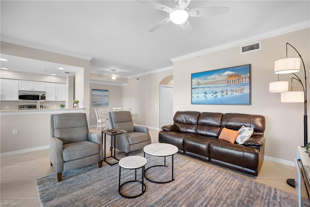 10265 Heritage Bay Boulevard, Unit 622 Naples, FL 34120 - Photo 12 of 50 a living room with furniture and kitchen view