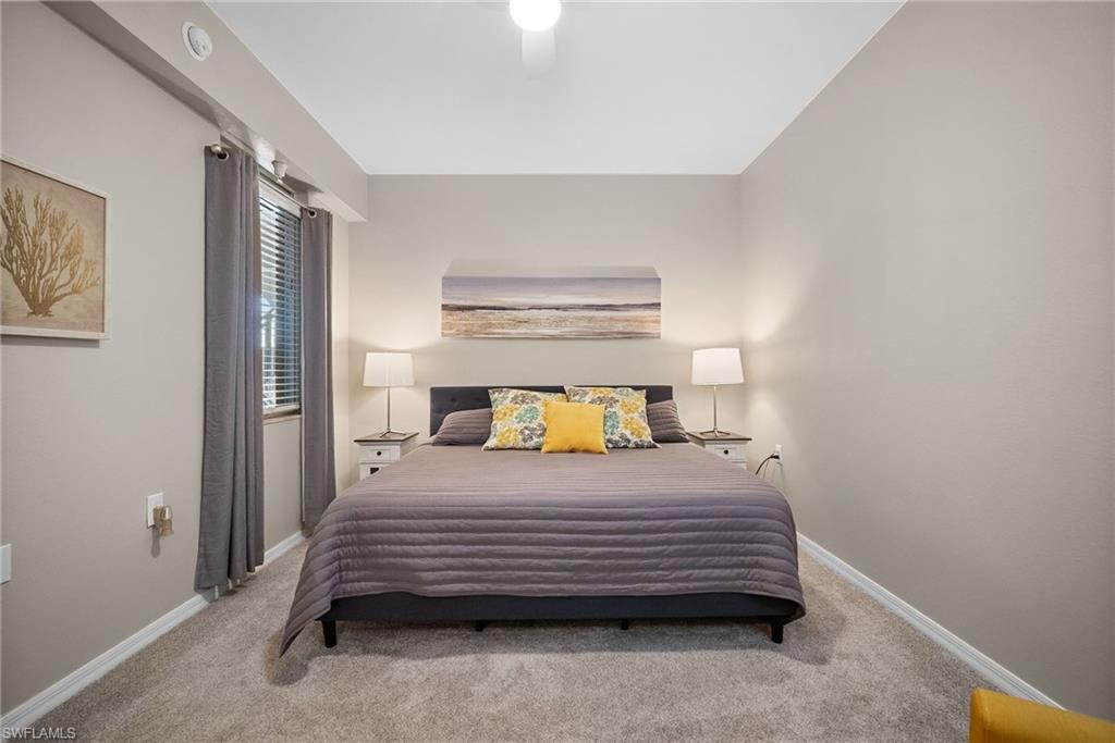 10265 Heritage Bay Boulevard, Unit 622 Naples, FL 34120 - Photo 24 of 50 a bedroom with a bed and a window