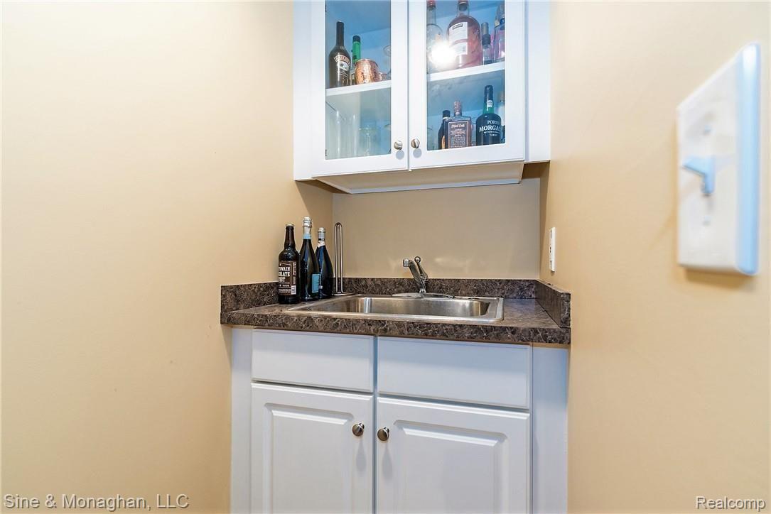 3120 Villanova Circle Rochester, MI 48307 - Photo 24 of 29 Bar sink and glass front cabinet