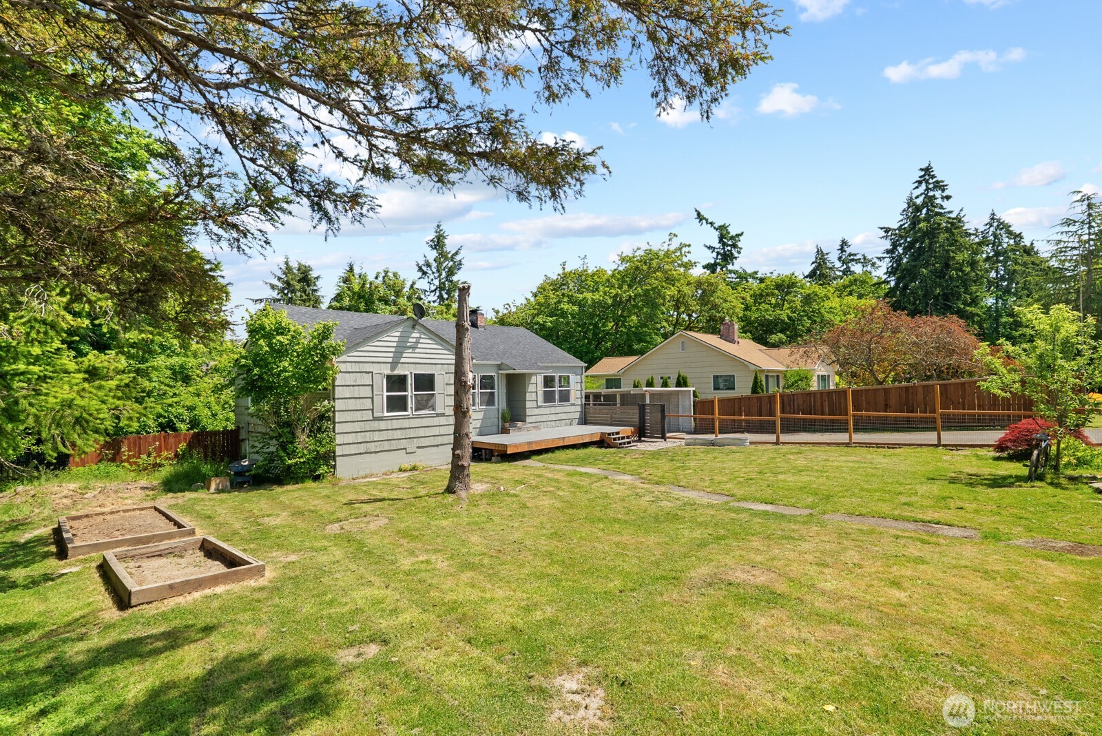 307 4th Street Steilacoom, WA 98388 - Photo 2 of 39 a front view of a house with a yard and trees