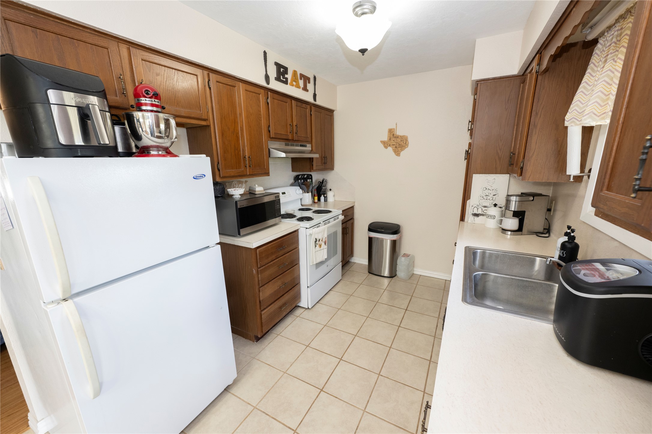 9503 Fm 389 Brenham, TX 77833 - Photo 17 of 23 a kitchen with a refrigerator and a sink