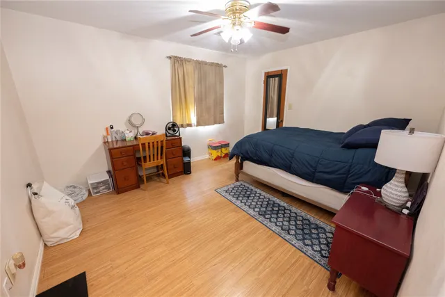 a bedroom with two beds and a chandelier