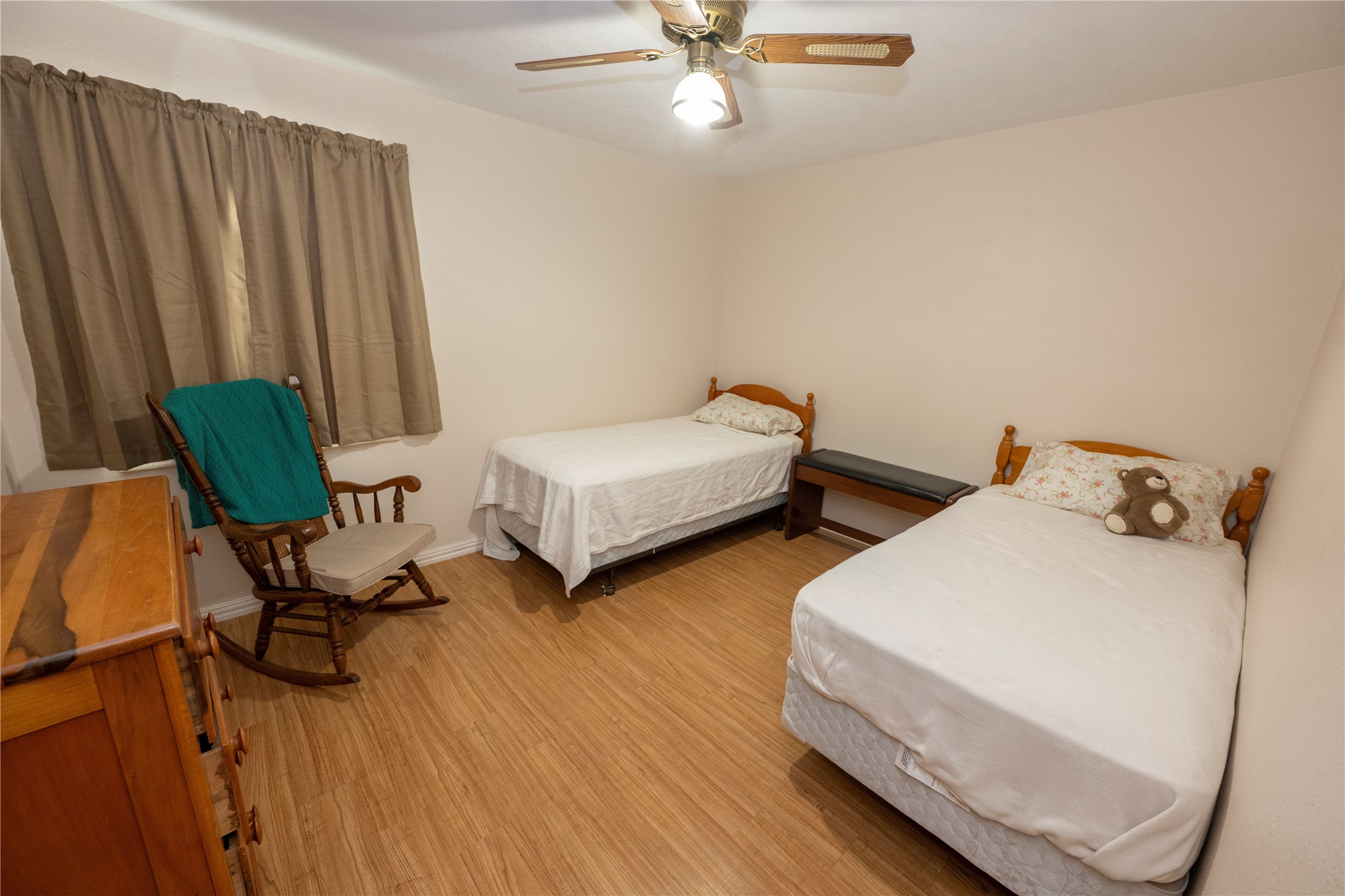 9503 Fm 389 Brenham, TX 77833 - Photo 20 of 23 a bedroom with two beds and a chandelier