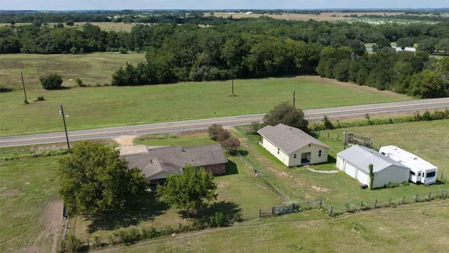 an aerial view of a house with a garden