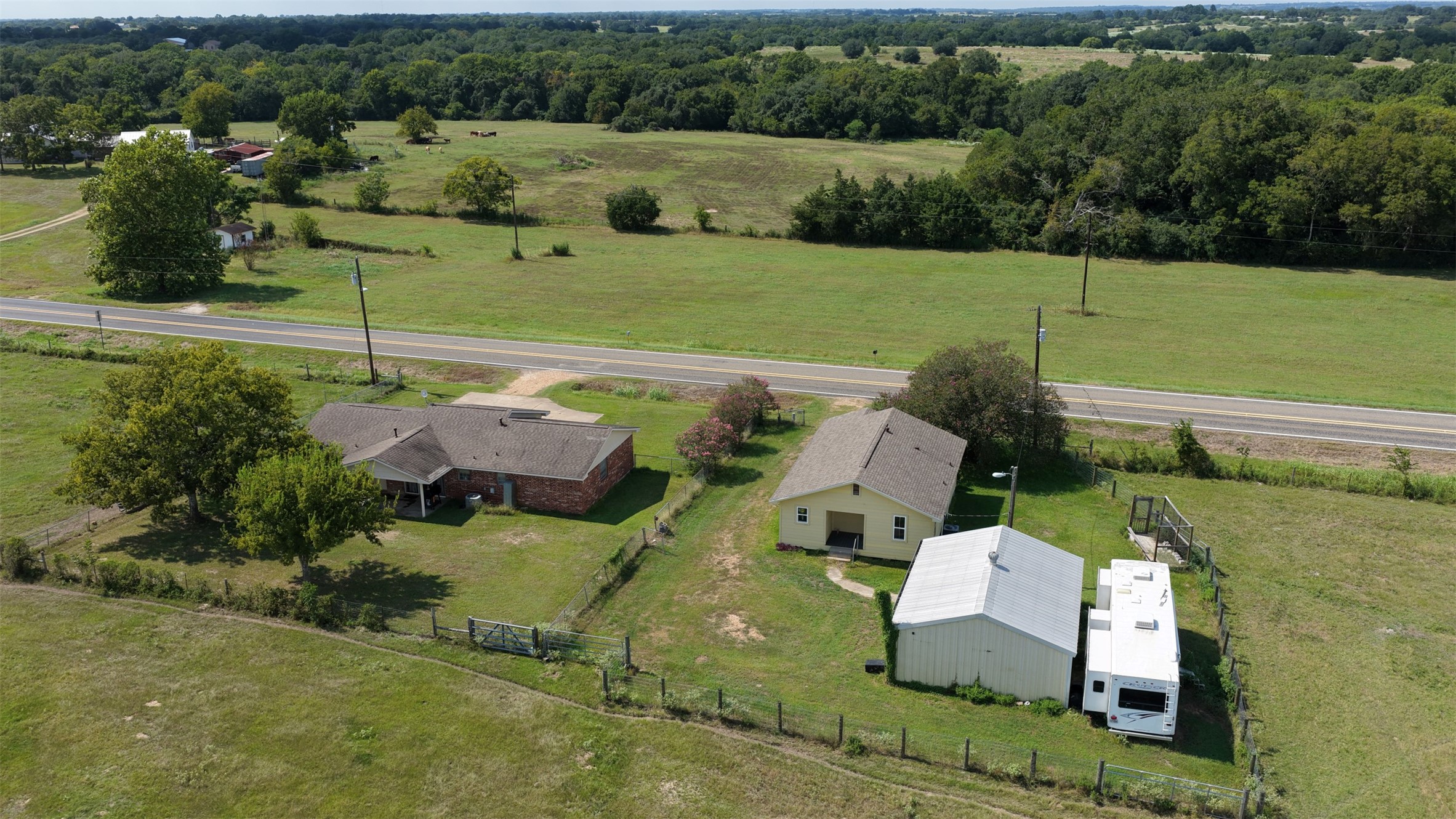 9503 Fm 389 Brenham, TX 77833 - Photo 10 of 23 an aerial view of a house with a garden