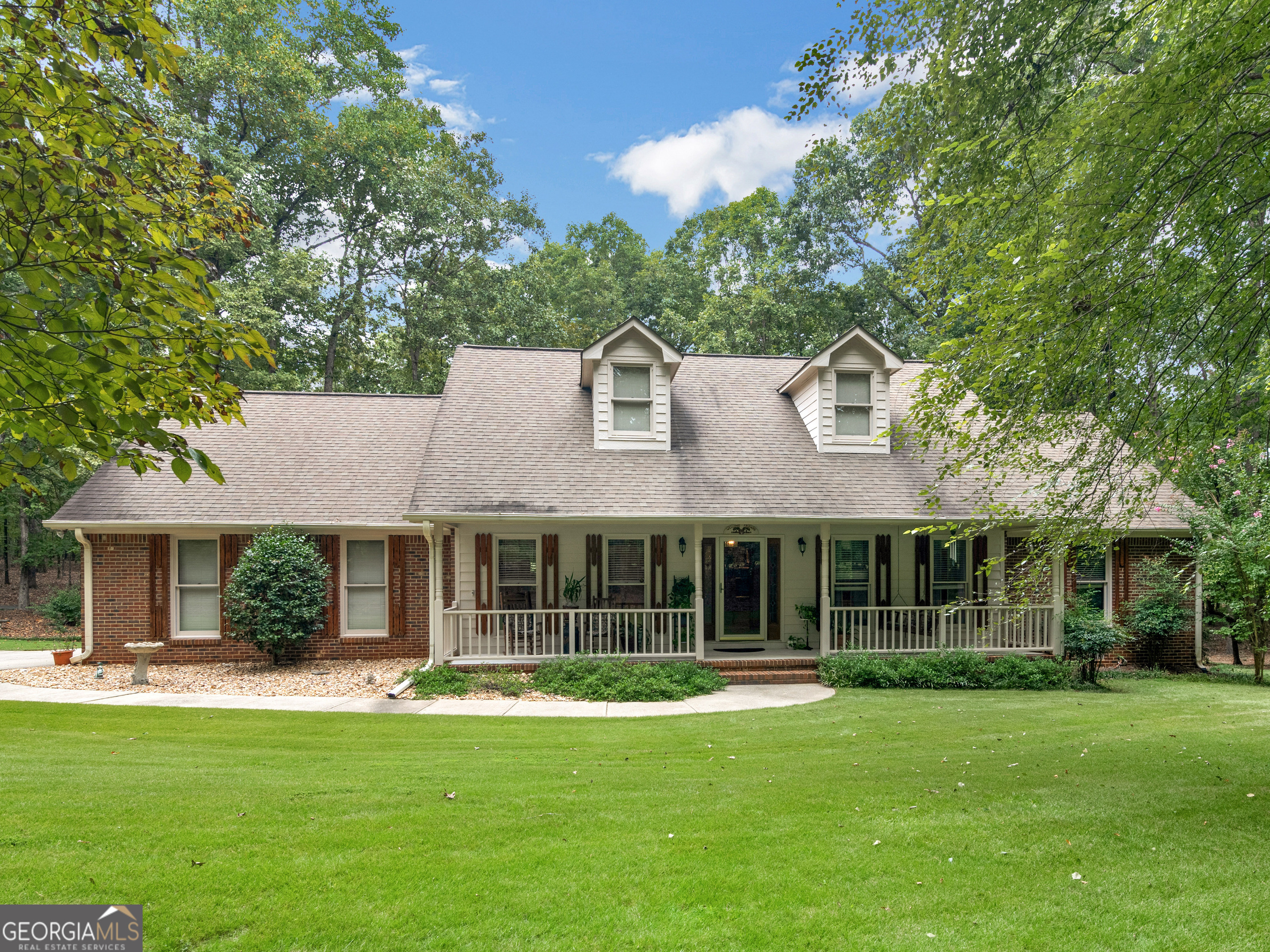 143 Hamlin Road Jackson, GA 30233 - Photo 1 of 1 a front view of a house with a garden