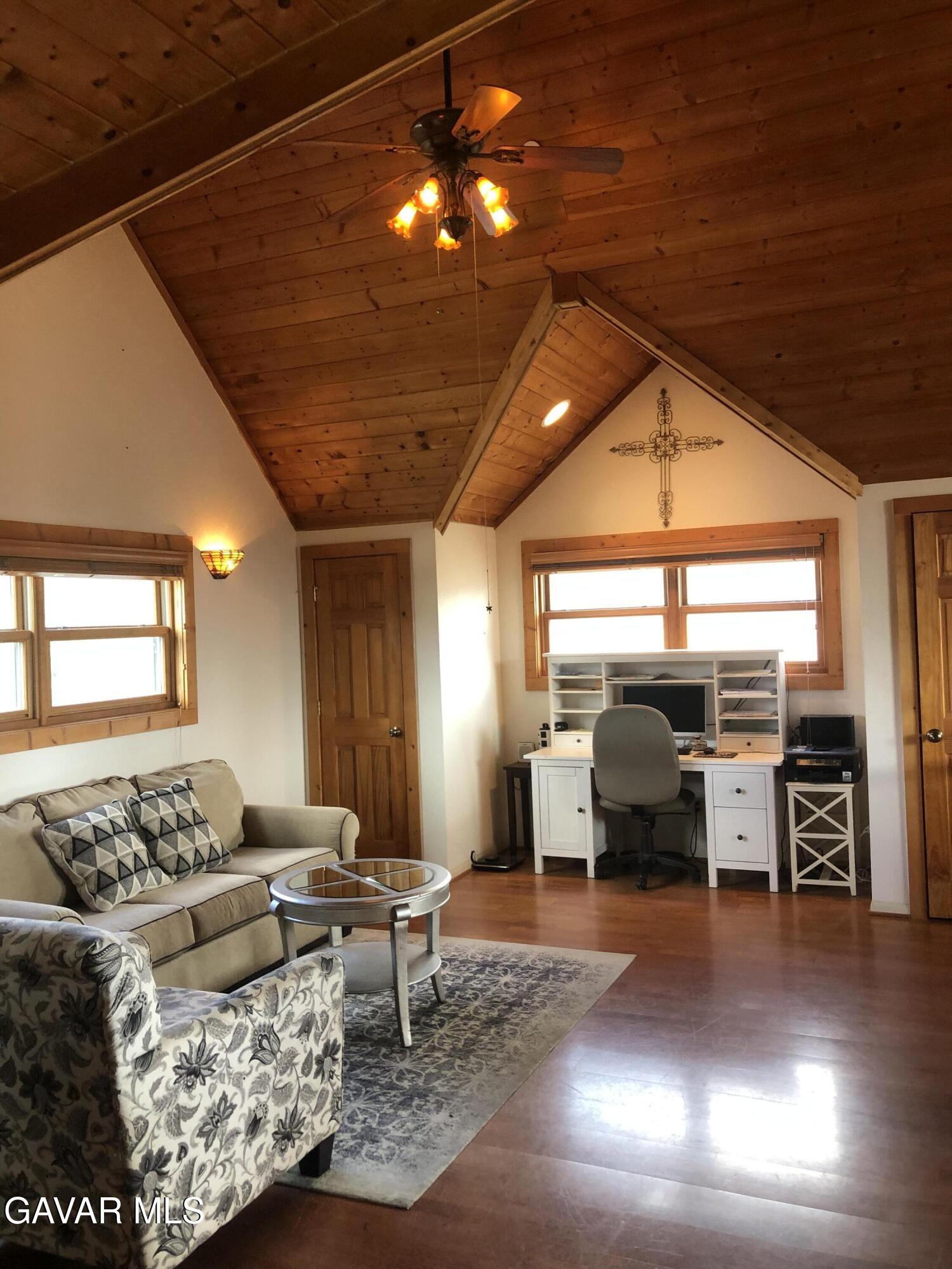 28147 Lake Wohlford Road Valley Center, CA 92082 - Photo 12 of 25 a living room with furniture and a flat screen tv