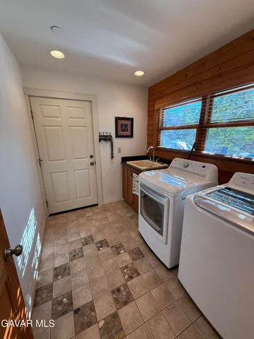 a view of a balcony with furniture and wooden floor