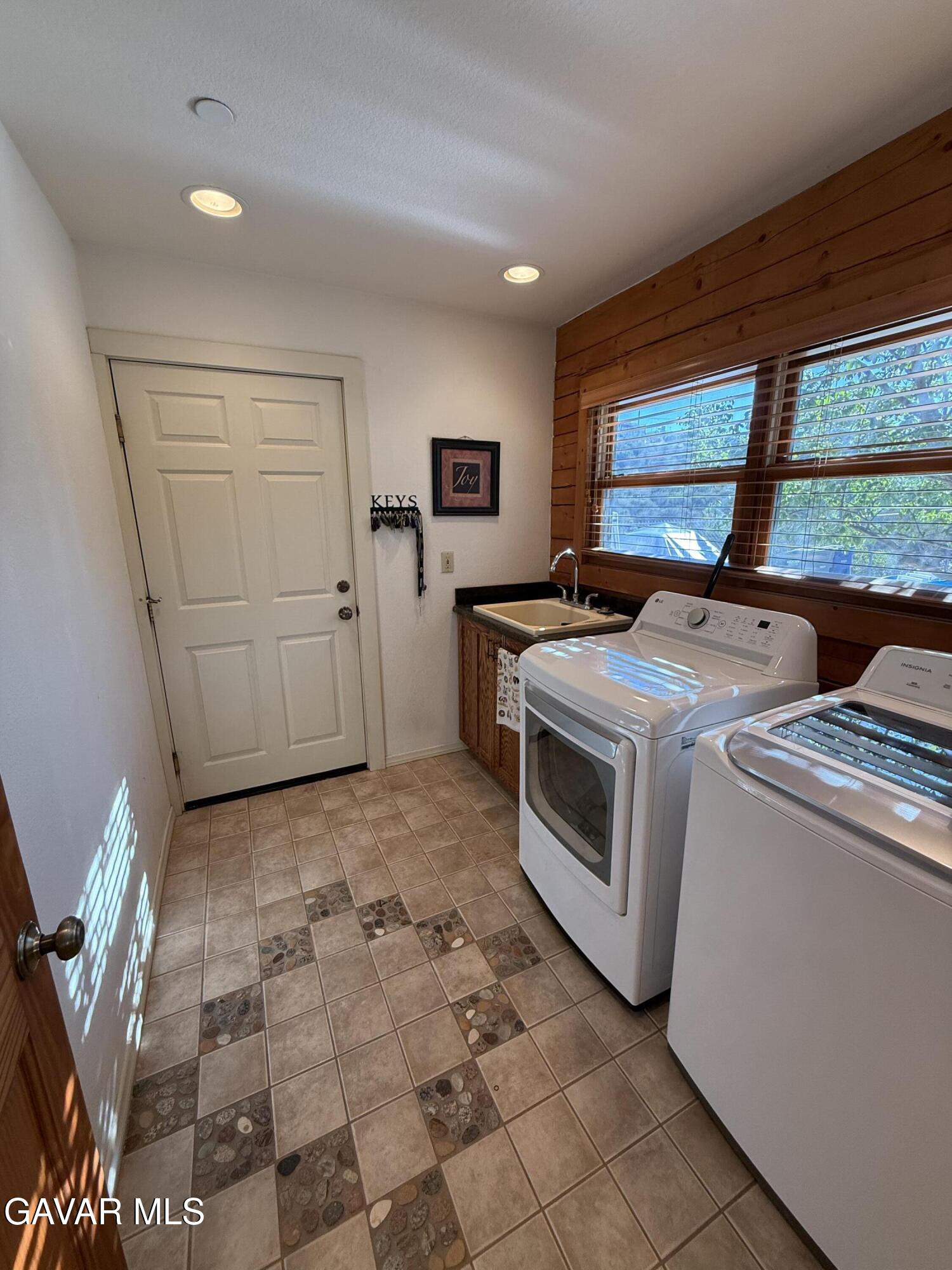 28147 Lake Wohlford Road Valley Center, CA 92082 - Photo 18 of 25 a utility room with dryer and washer