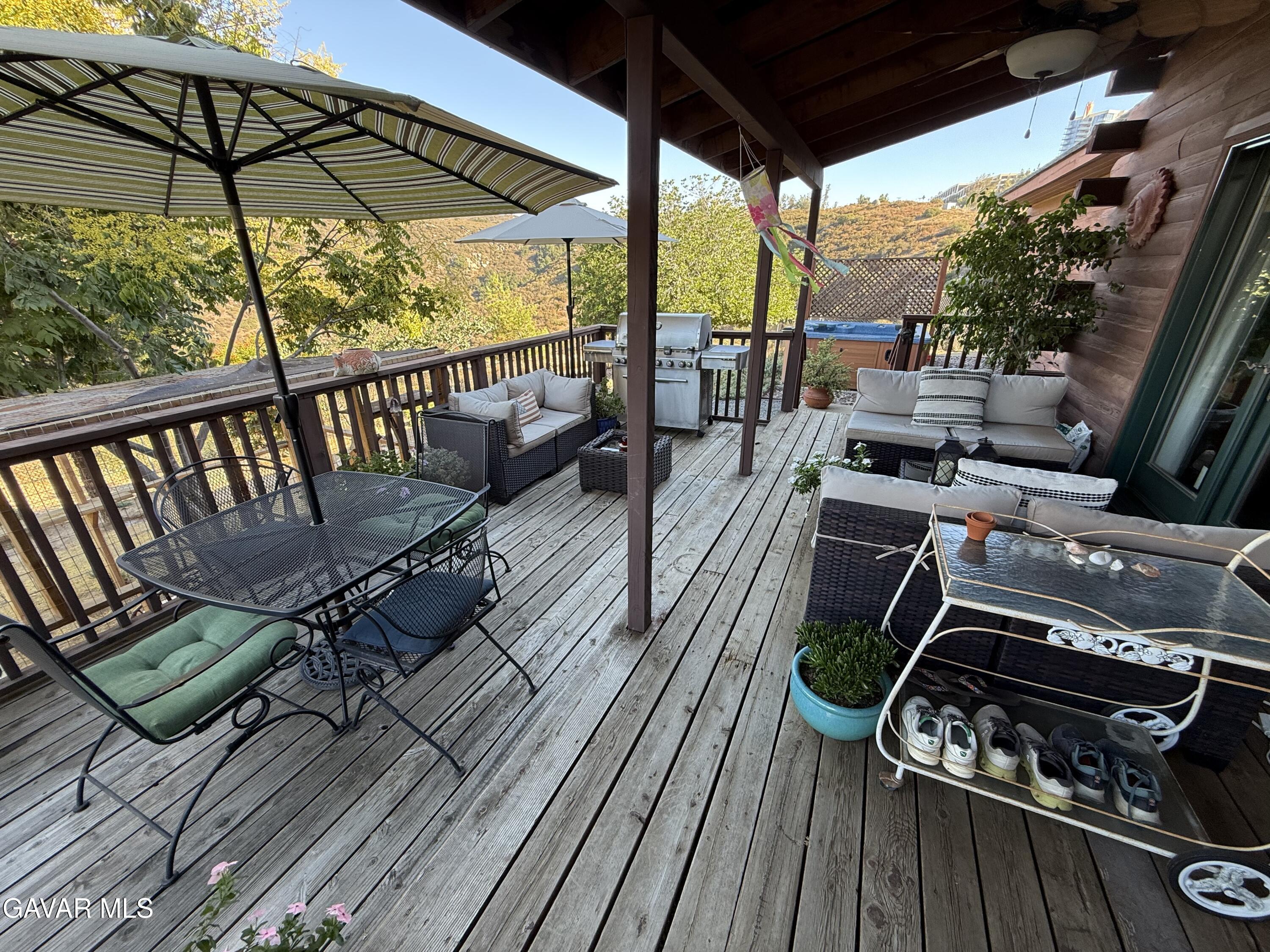 28147 Lake Wohlford Road Valley Center, CA 92082 - Photo 19 of 25 a view of a balcony with furniture and wooden floor