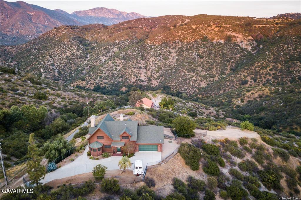 28147 Lake Wohlford Road Valley Center, CA 92082 - Photo 23 of 25 an aerial view of a house with a mountain