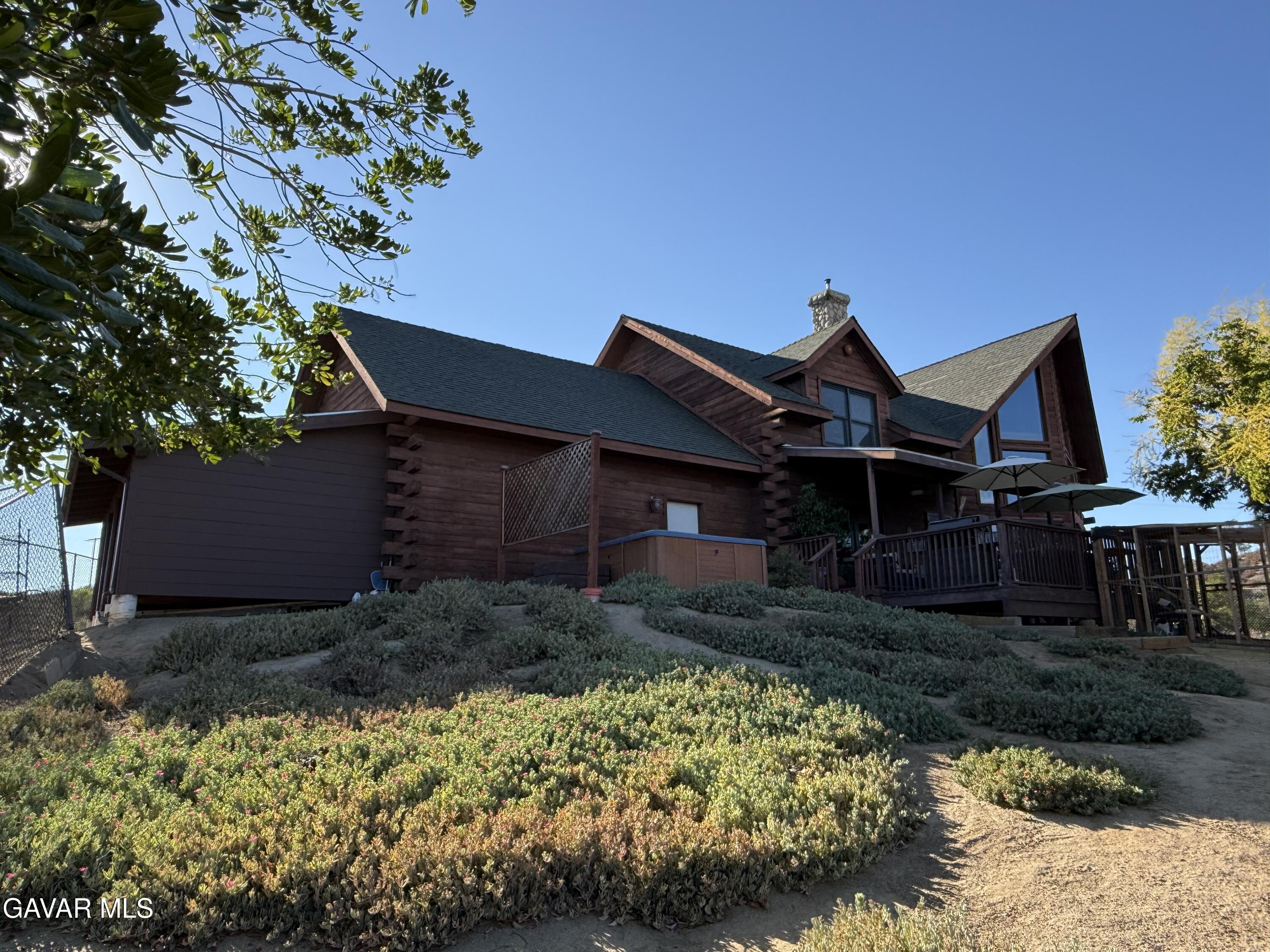 28147 Lake Wohlford Road Valley Center, CA 92082 - Photo 24 of 25 a front view of a house with garden