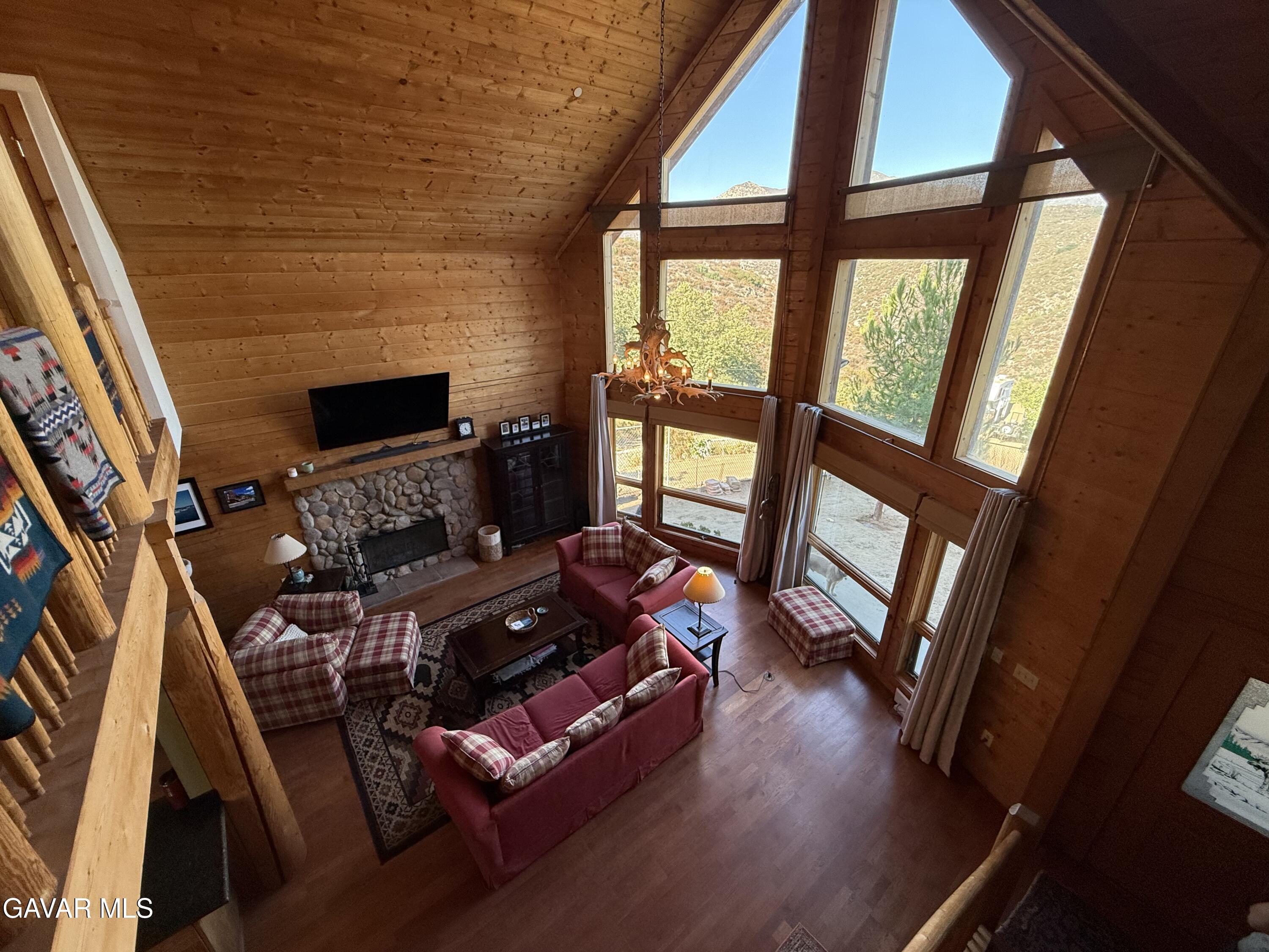 28147 Lake Wohlford Road Valley Center, CA 92082 - Photo 3 of 25 a living room with furniture and a flat screen tv