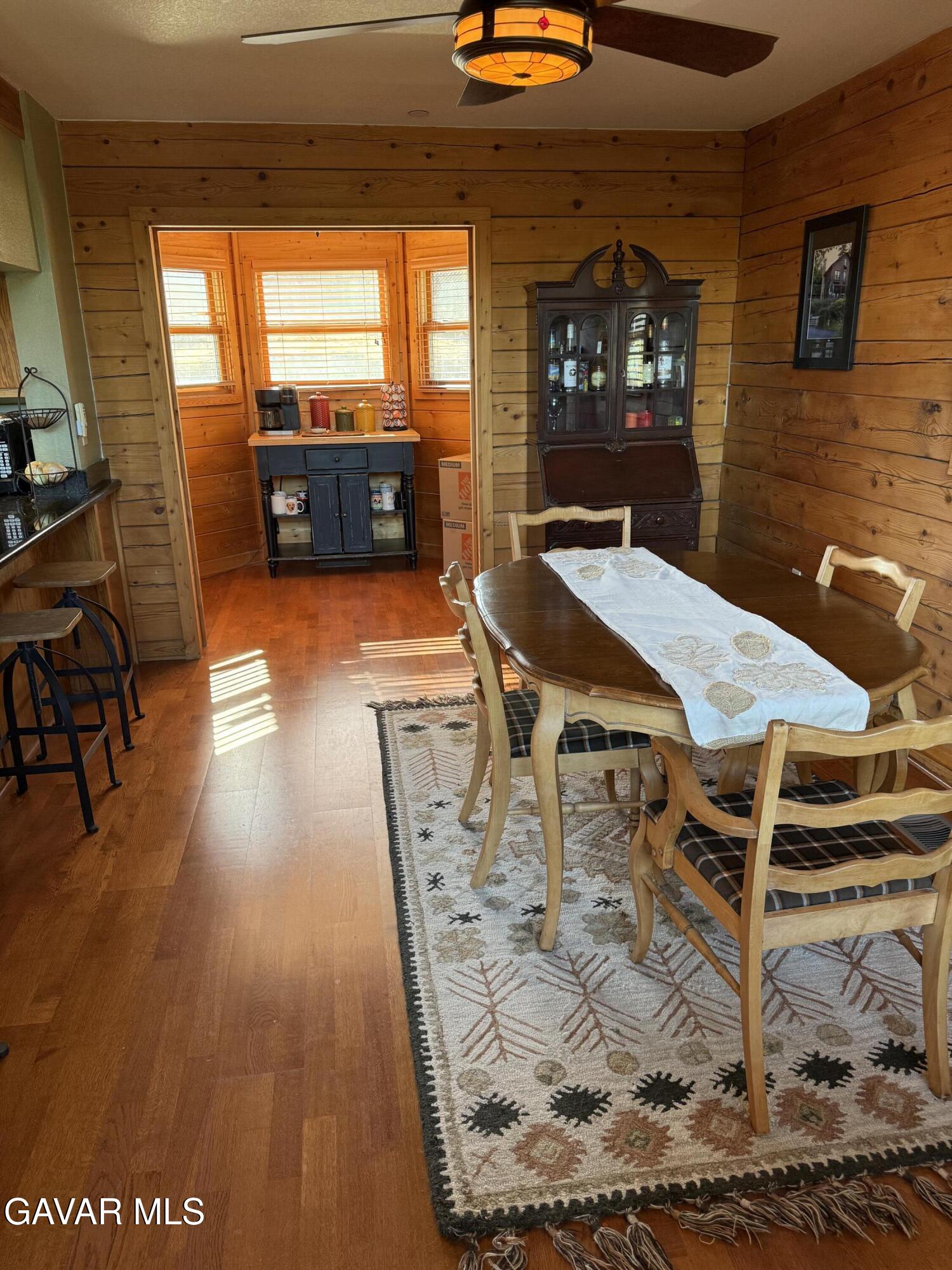 28147 Lake Wohlford Road Valley Center, CA 92082 - Photo 8 of 25 a view of a dining room with furniture window and wooden floor