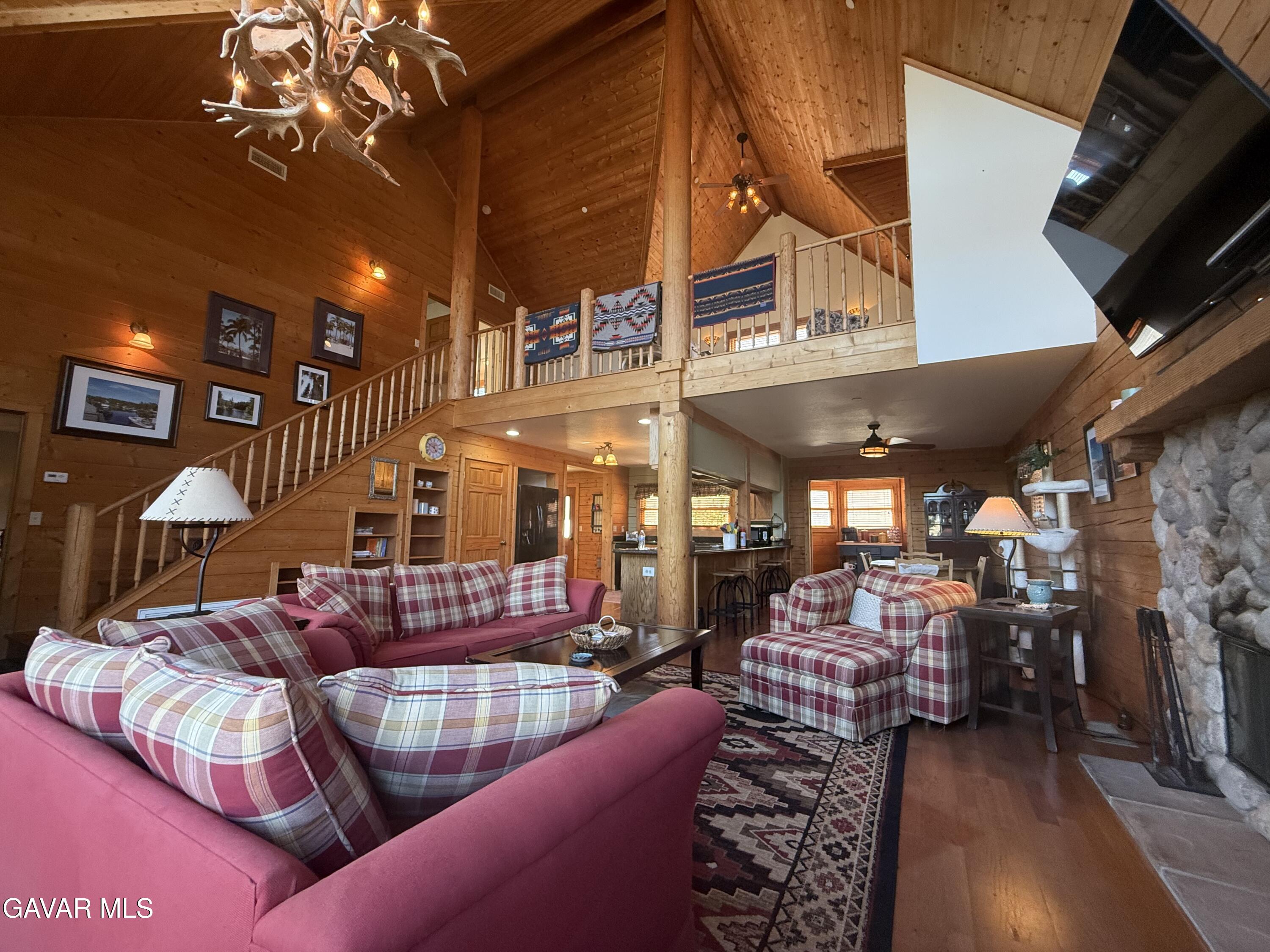 28147 Lake Wohlford Road Valley Center, CA 92082 - Photo 9 of 25 a living room with furniture a flat screen tv and entryway