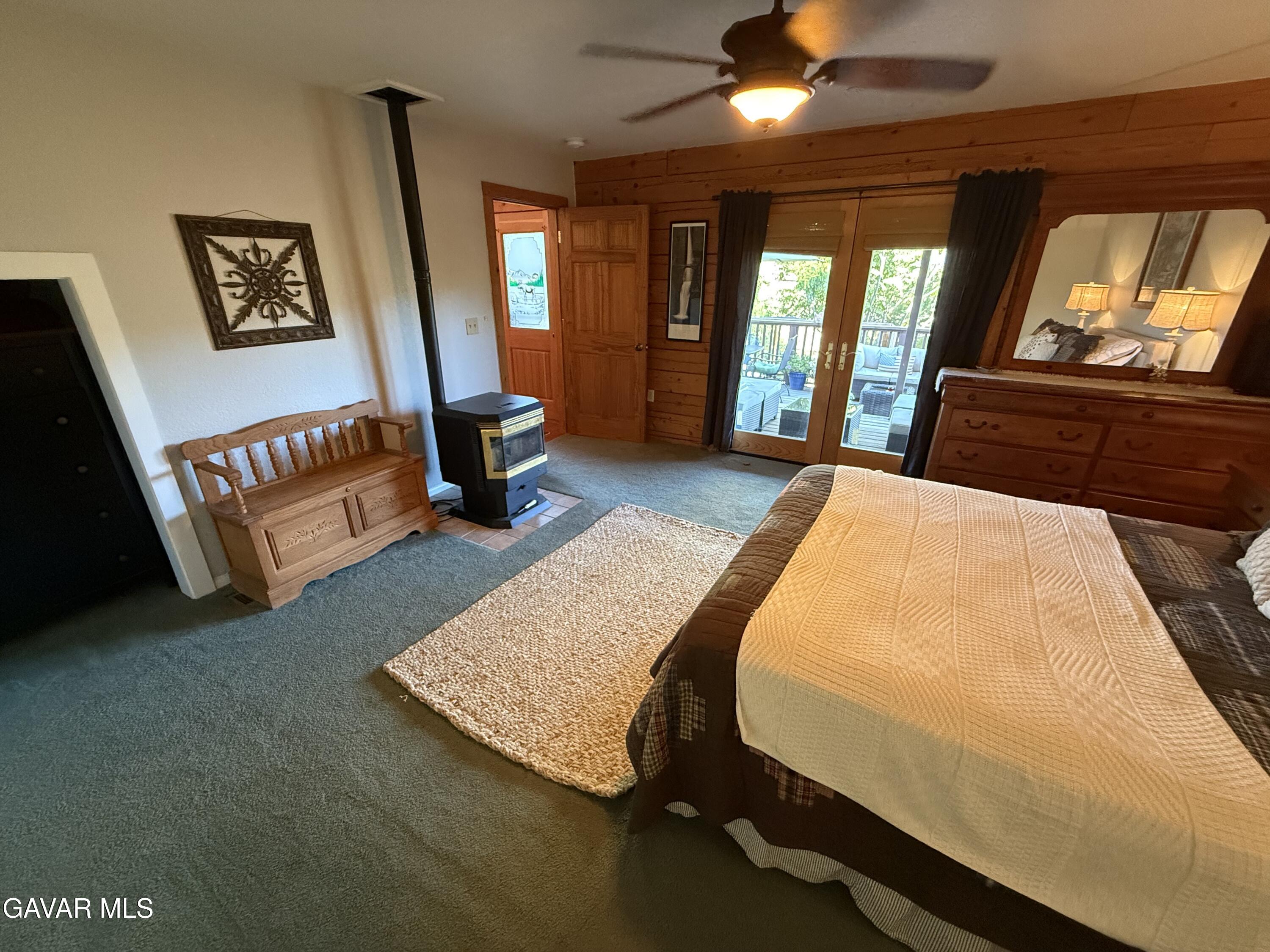28147 Lake Wohlford Road Valley Center, CA 92082 - Photo 10 of 25 a bed room with a bed tv and a large window