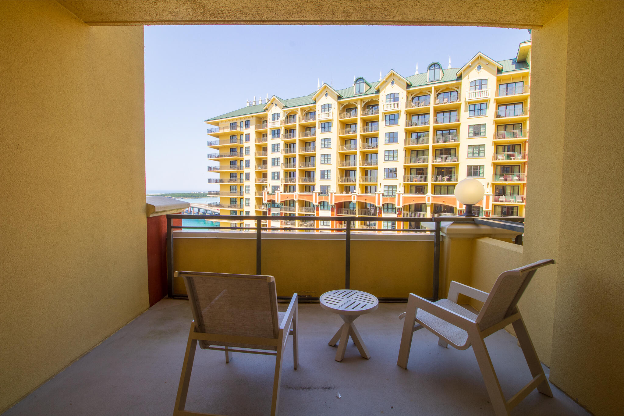 10 Harbor Boulevard, Unit E803G Destin, FL 32541 - Photo 11 of 28 a view of a chair and table in the backyard