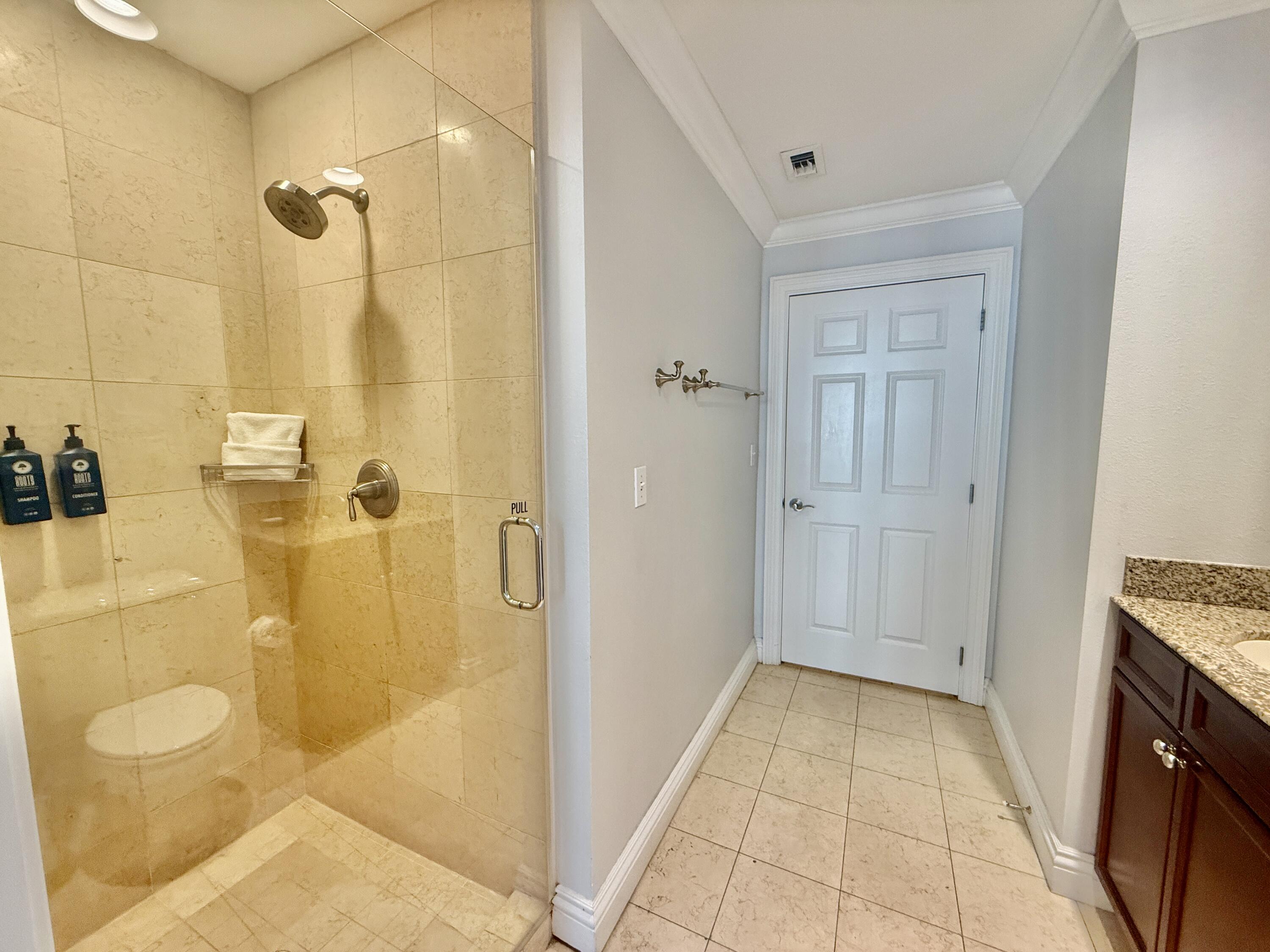 10 Harbor Boulevard, Unit E803G Destin, FL 32541 - Photo 15 of 28 a bathroom with a granite countertop shower