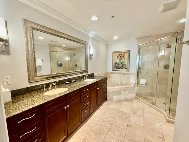 a spacious bathroom with a double vanity sink mirror double and shower
